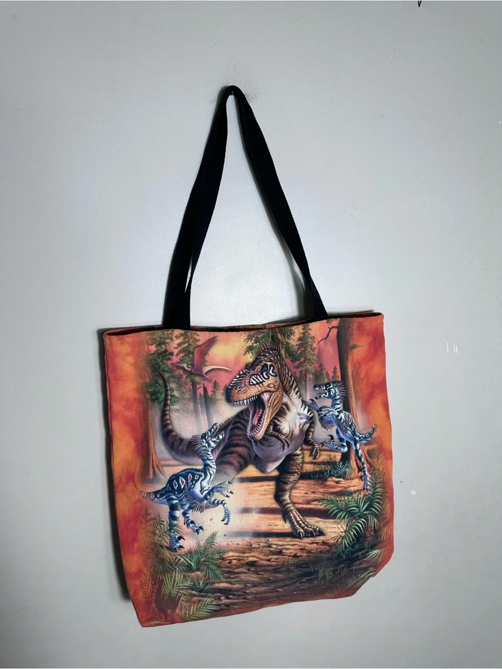 The Mountain Orange Dinosaur Messenger Bag with Black Straps